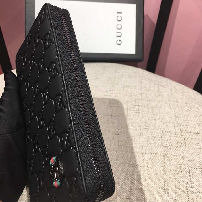 Clutch bag Gucci zip around embossed GG leather Black Size 19x10cm