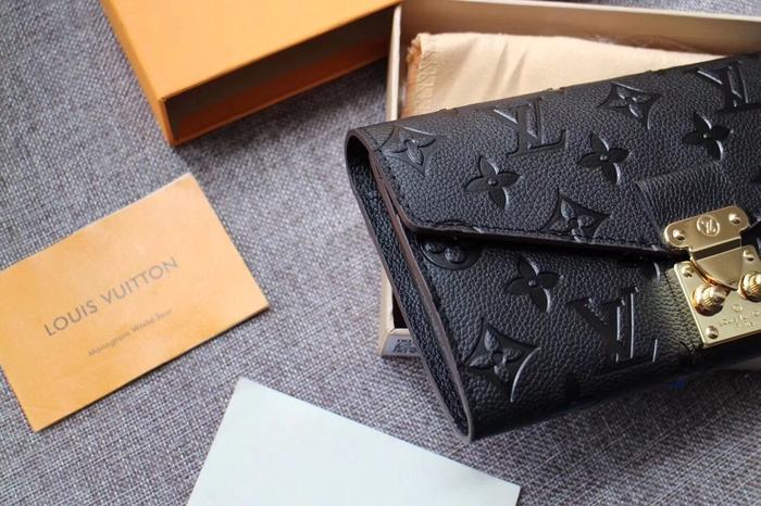 Wallet Louis Vuitton embossed monogram long wallet Black Size 19x10.5x2.5cm