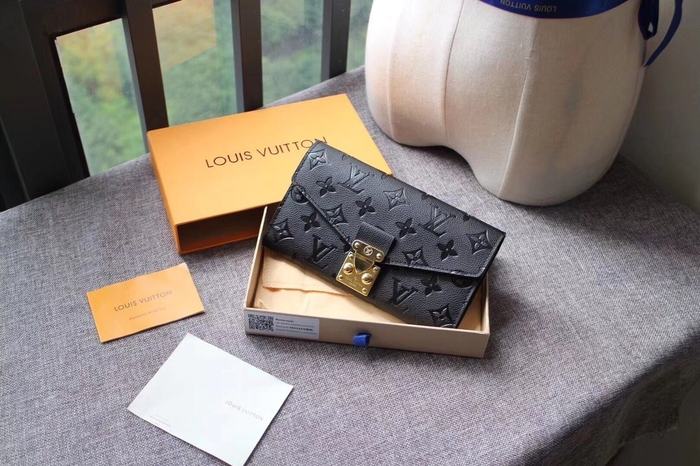 Wallet Louis Vuitton embossed monogram long wallet Black Size 19x10.5x2.5cm