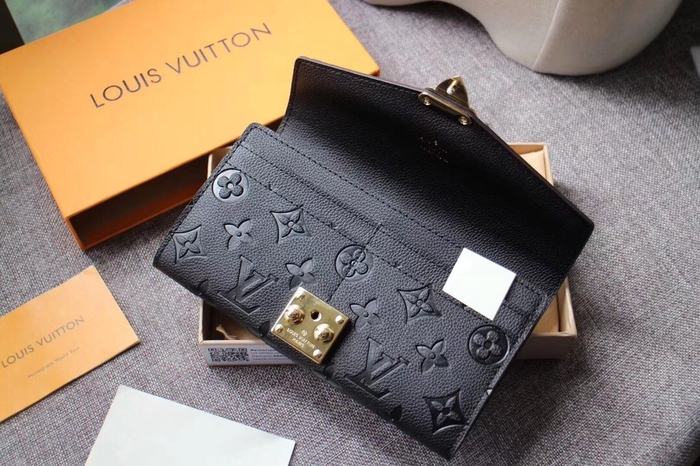 Wallet Louis Vuitton embossed monogram long wallet Black Size 19x10.5x2.5cm