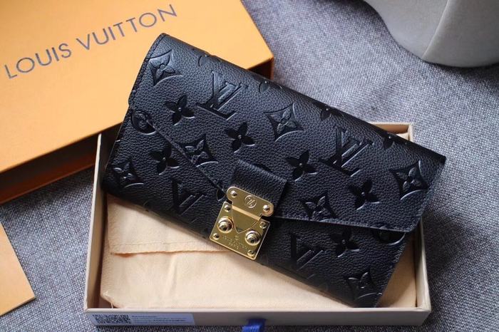 Wallet Louis Vuitton embossed monogram long wallet Black Size 19x10.5x2.5cm