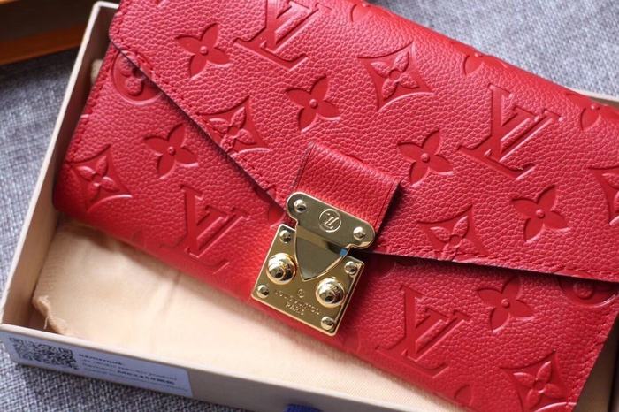 Wallet Louis Vuitton long embossed monogram wallet Red Size 19x10.5x2.5cm