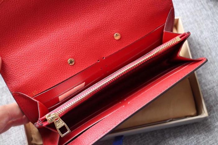 Wallet Louis Vuitton long embossed monogram wallet Red Size 19x10.5x2.5cm