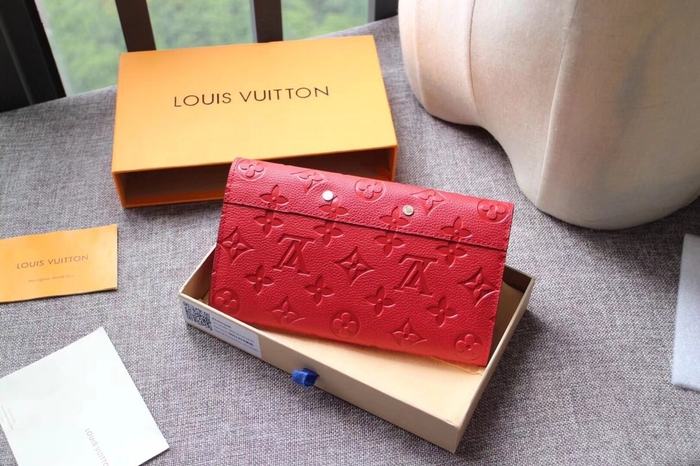 Wallet Louis Vuitton long embossed monogram wallet Red Size 19x10.5x2.5cm