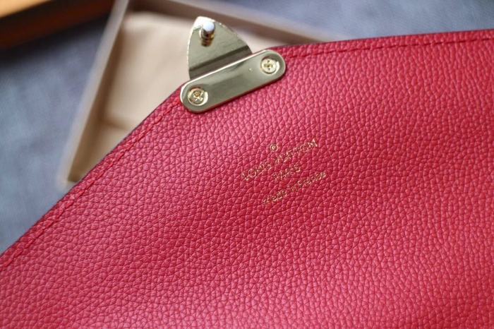 Wallet Louis Vuitton long embossed monogram wallet Red Size 19x10.5x2.5cm