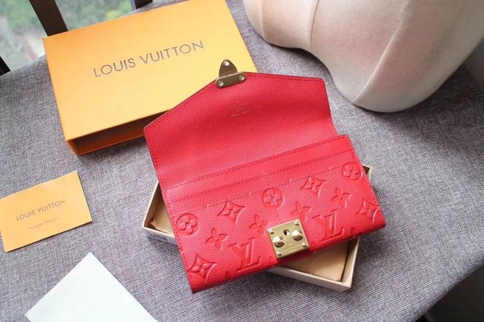 Wallet Louis Vuitton long embossed monogram wallet Red Size 19x10.5x2.5cm